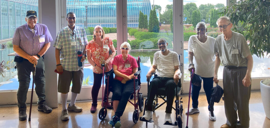 Members of Cassia’s adult day services gather at the Como Zoo Conservatory, smiling as they explore the vibrant gardens and exhibits, enjoying a day of connection, nature and independence in a supportive and engaging environment