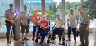 Members of Cassia’s adult day services gather at the Como Zoo Conservatory, smiling as they explore the vibrant gardens and exhibits, enjoying a day of connection, nature and independence in a supportive and engaging environment