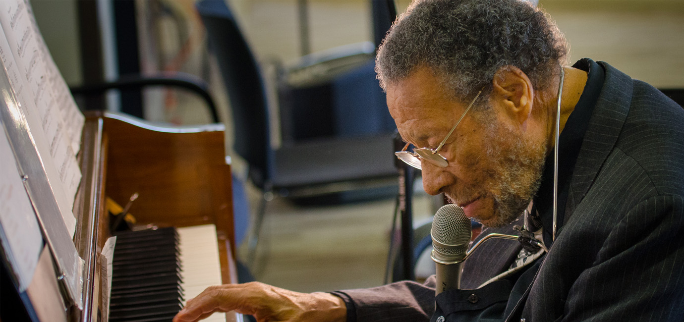 Member plays piano